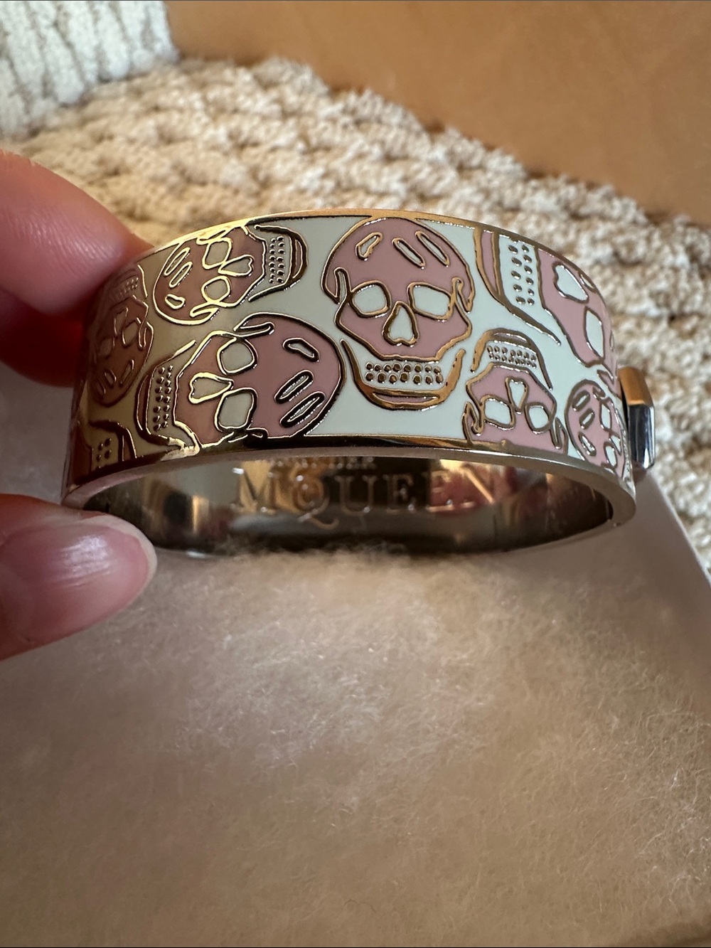 Alexander McQueen Pink Skull Enamel Bangle with Cream Background